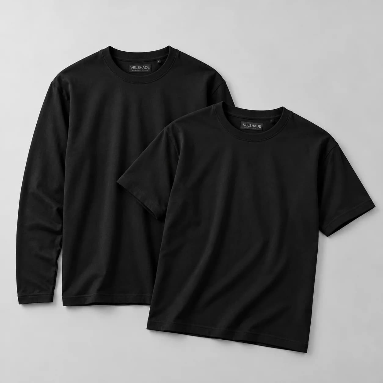 Overlapping Black T-Shirts with VELSHADE Labels-5.png
